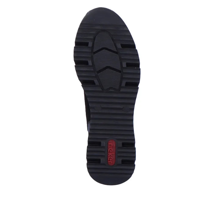 Women's black zip boot outsole with deep tread and textured traction