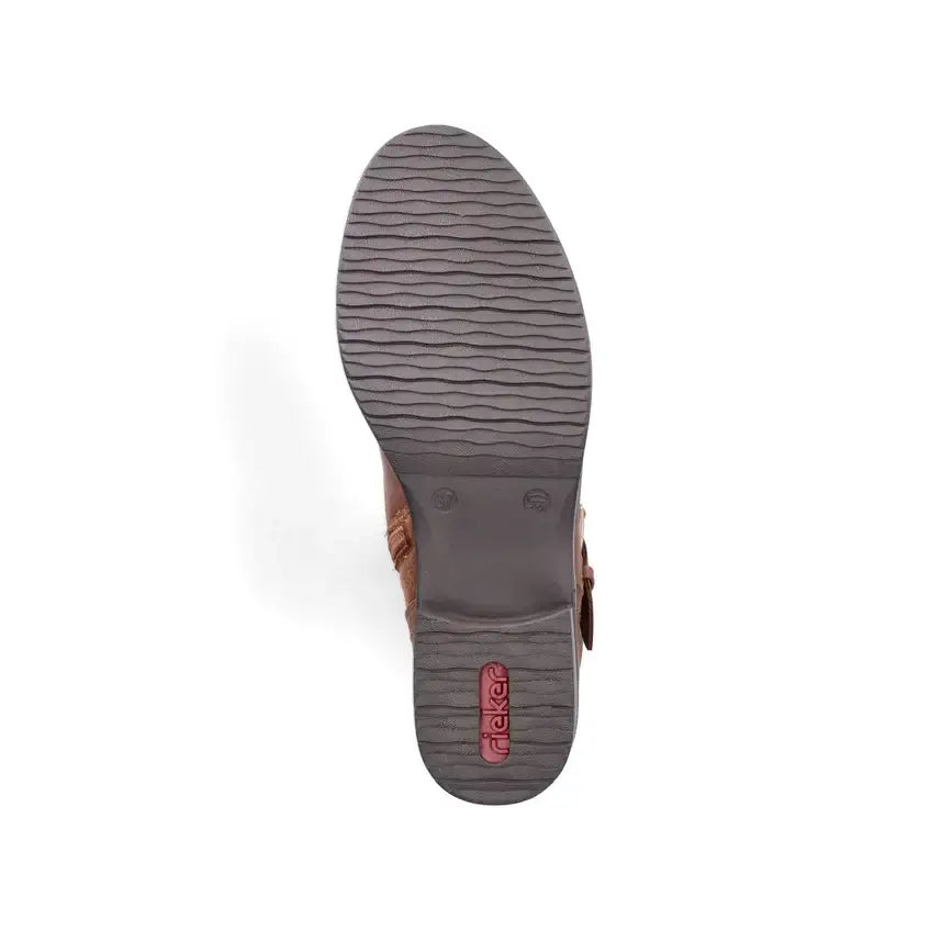 Brown boot outsole with textured tread and buckle strap details