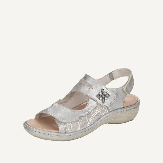 Silver sandal with a butterfly design on a white background