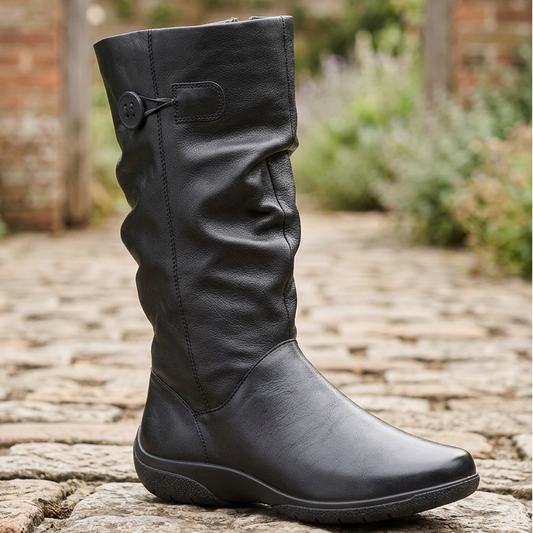 Black leather mid-calf pull-on boot with buckle strap and cushioned sole