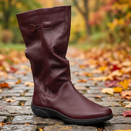 Women’s wide-fit leather boot in dark cherry with side buckle strap and supportive wedge sole.