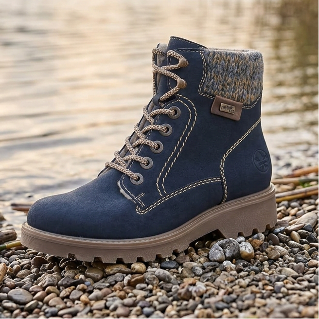 Blue lace-up biker boots with fur-lined collar and treaded outsole