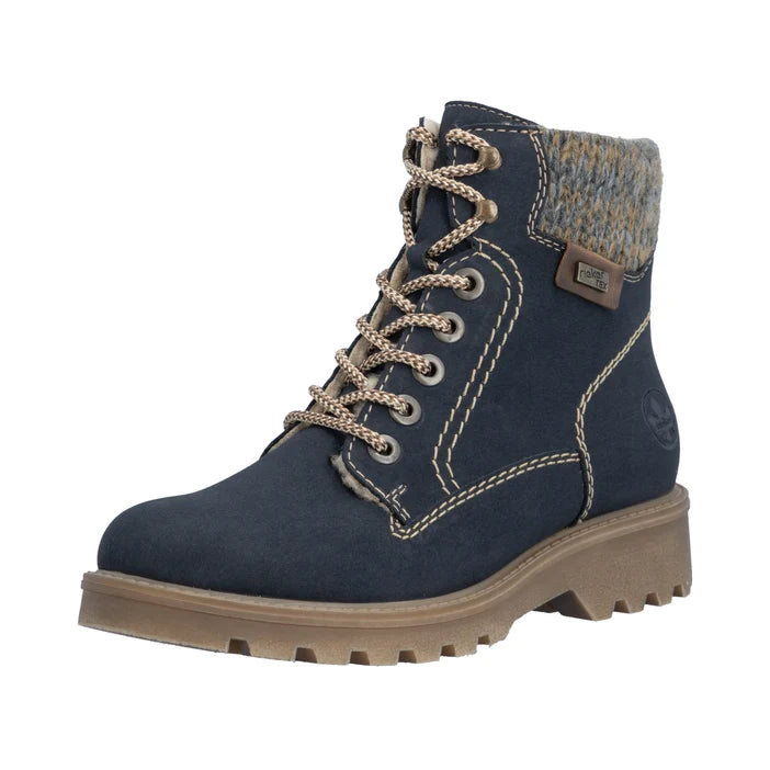 Women’s blue biker lace-up boots with beige fur collar and chunky lug sole