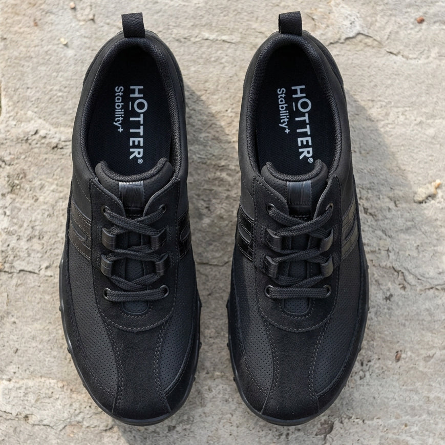 Black trainers with “Hotter” branding on tongue lining and lace-up front