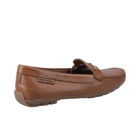 Women's tan leather loafer with decorative metal strap and cushioned sole