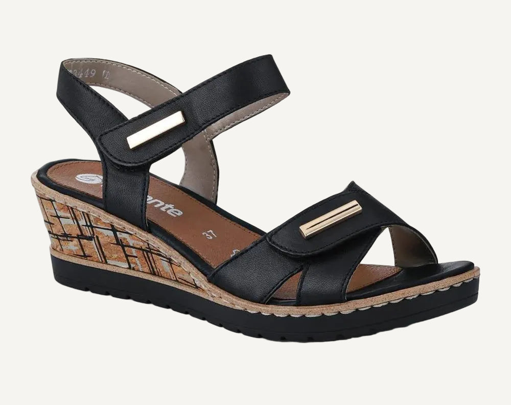 Black wedge sandal with a checkered sole on a white background